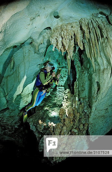 Scuba diver in underwater cave Cueva Taina  Punta Cana  Dominican Republic