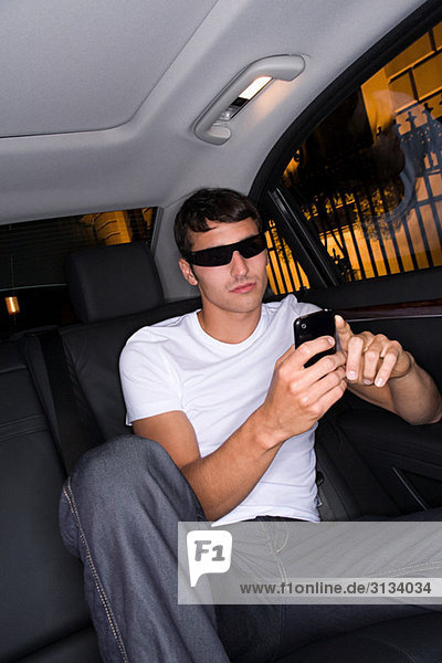 Cool man text messaging in car
