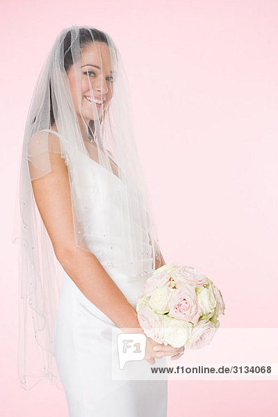 Portrait of a bride holding a bouquet