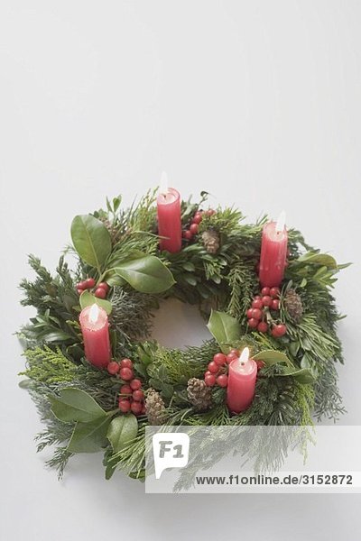 Advent wreath with four burning candles