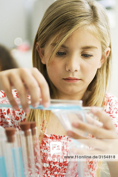 Elementary student conducting science experiment