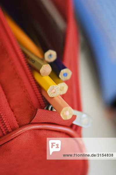 Pencil case filled with colored pencils  close-up