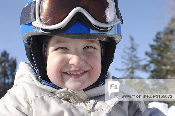 Young boy wearing ski helmet and goggles  King City  Ontario