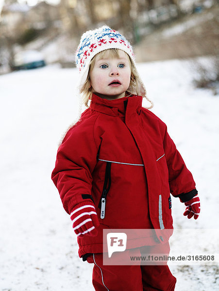 A girl playing in the snow Sweden.