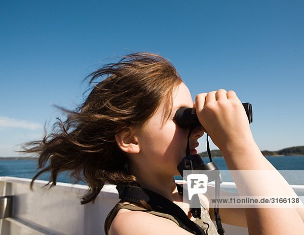A girl with a binoculars  Sweden.
