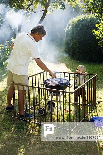 A man barbecuing  Sweden.
