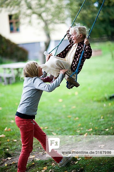 Scandinavian girls by a swing  Sweden.