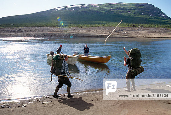 Hikers on a beach  Lapland  Sweden.