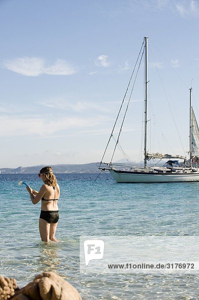 A woman taking a swim  Sardinia  Italy.