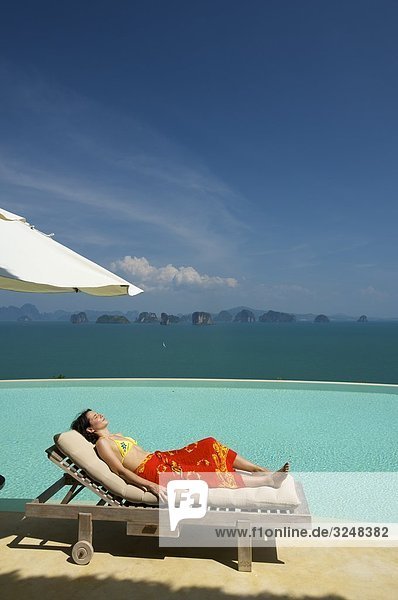 Woman lying on sunlounger  Evason Six Senses Hideaway  Yao Noi  Thailand