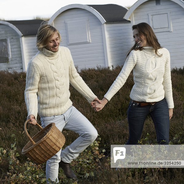 Young couple holding hands  Skane  Sweden.