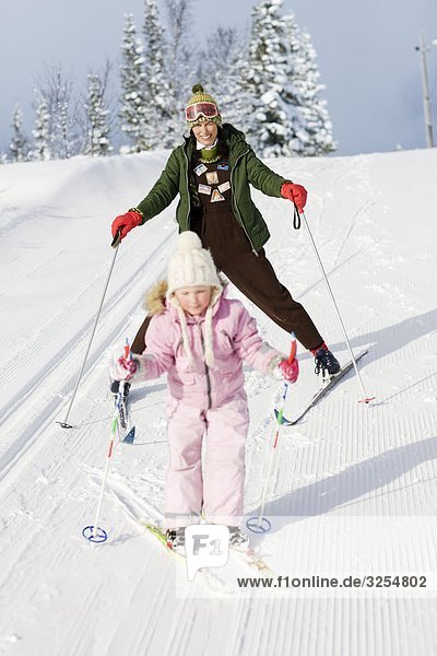 Mother and daughter skiing  Sweden.