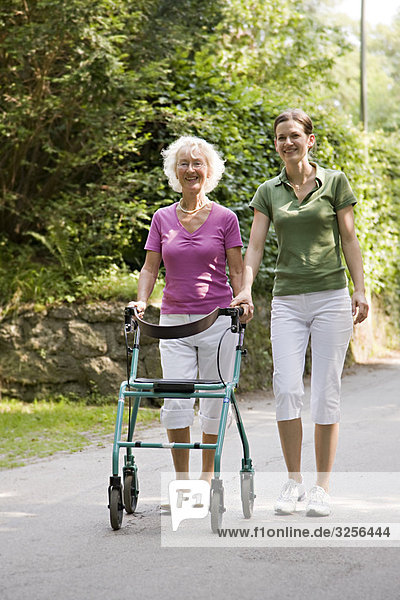 woman walking with senior woman