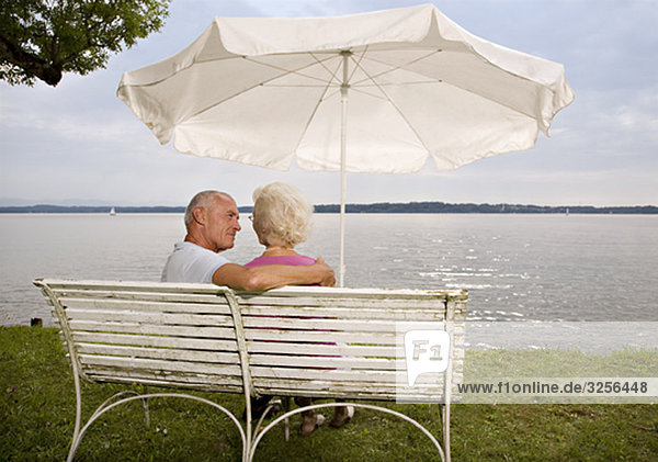 senior man and woman on old bench