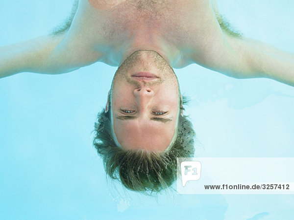 young man floating in water