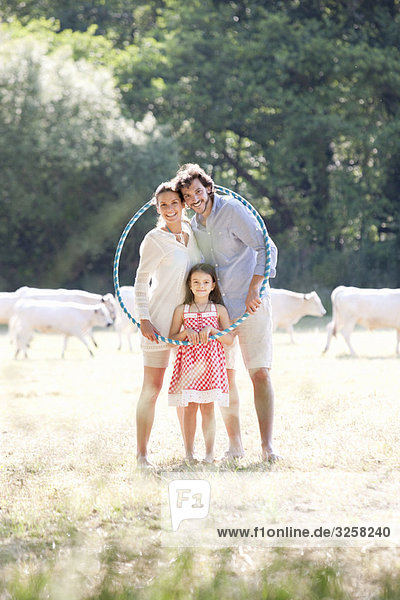 Family portrait with hoop in field