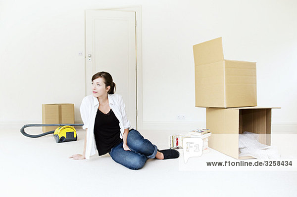 A young female with cardboard boxes