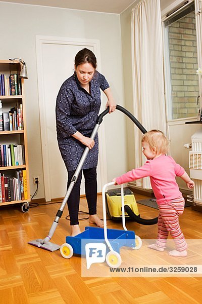 A woman vacuuming  Sweden.