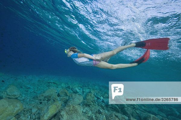 Croatia  Girl (6-7) snorkeling