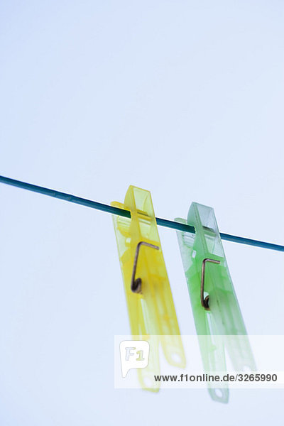 Clothes pegs on clothesline  close-up