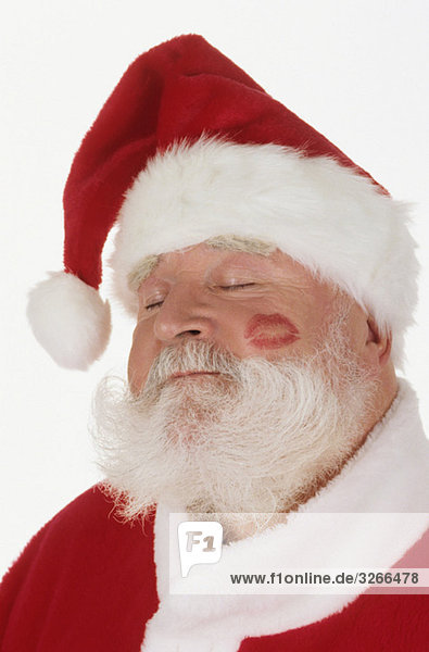 Weihnachtsmann mit Lippenstift auf der Wange  Portrait  Nahaufnahme