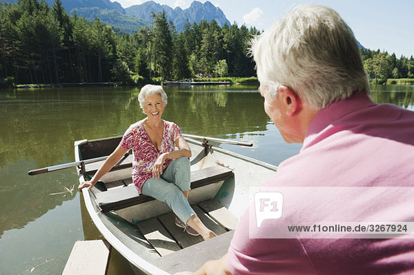 Italy  South Tyrol  Senior couple in rowing boat  portrait