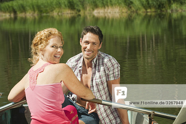 Italy  South Tyrol  Couple in rowing boat  smiling  portrait
