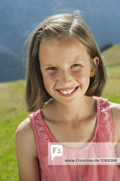Italy  South Tyrol  Girl (10-11) smiling  portrait  close-up