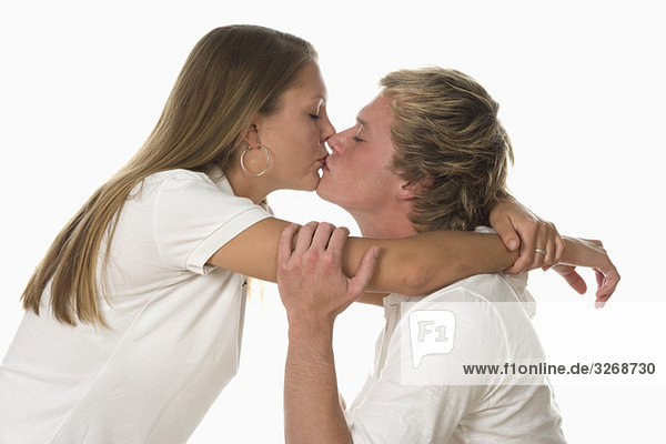 Young couple kissing  portrait