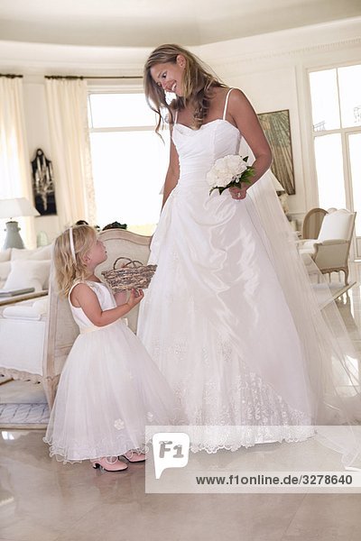 Bride with young flower girl