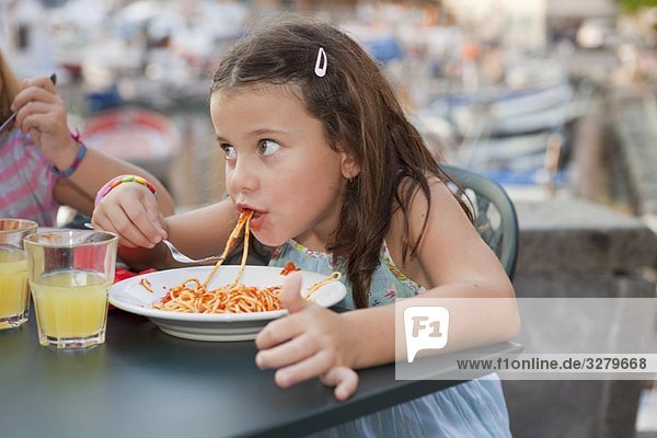 girl eating spaghetti