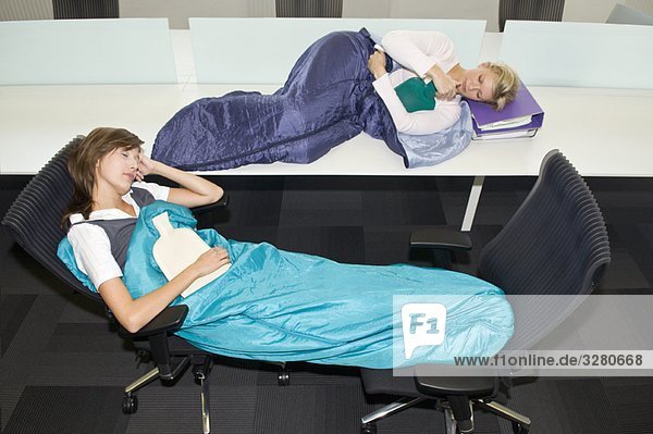 Business women sleeping in the office
