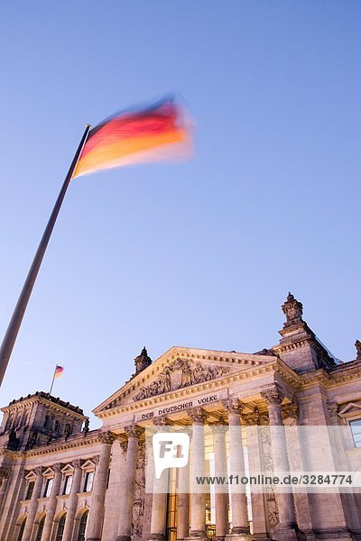 Reichstag and german flag  Berlin  Germany