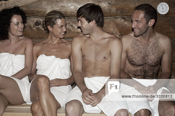 Four friends in a sauna