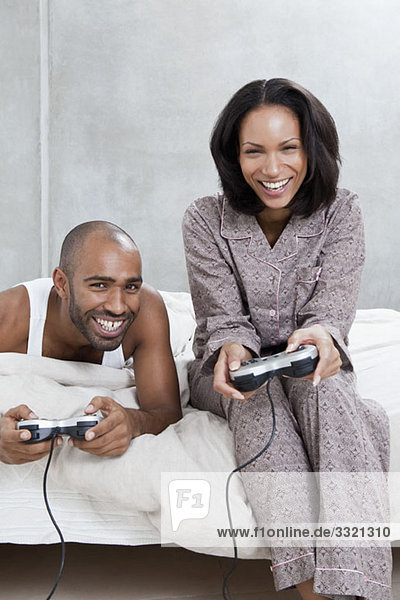 A young couple playing a video game