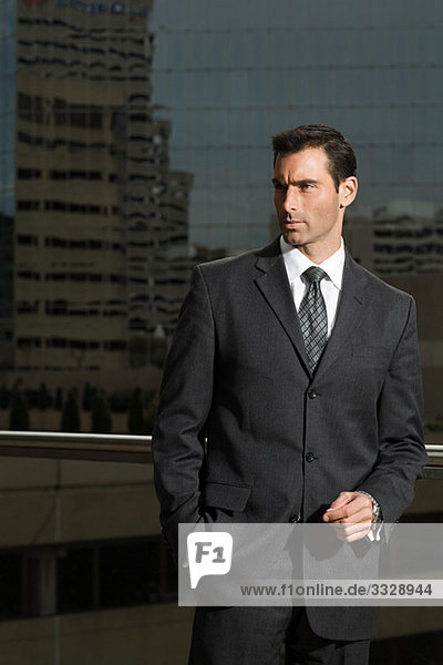 Portrait of a businessman against a city background