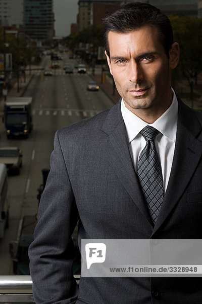 Portrait of a businessman against a city background