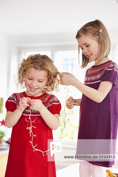 children playing with decoration lights