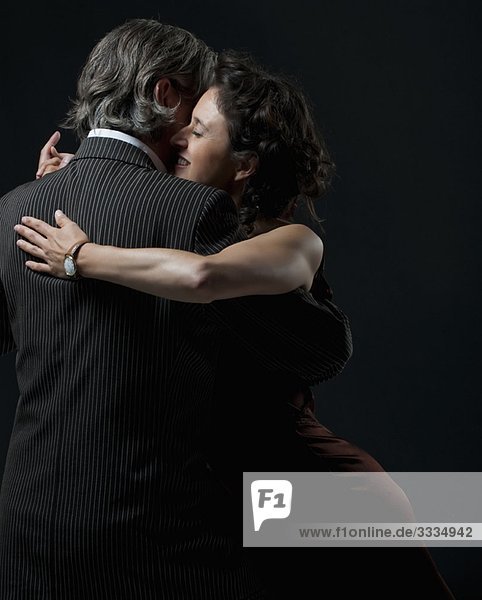 man & woman dancing tango