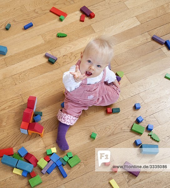 baby with toy building blocks