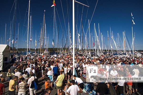 Crowd of people before the beginning of a sailing competition  Sandhamn  Stockholm archipelago  Sweden.