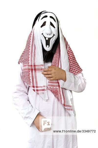 Studio shot of man dressed up as arab wearing Halloween mask