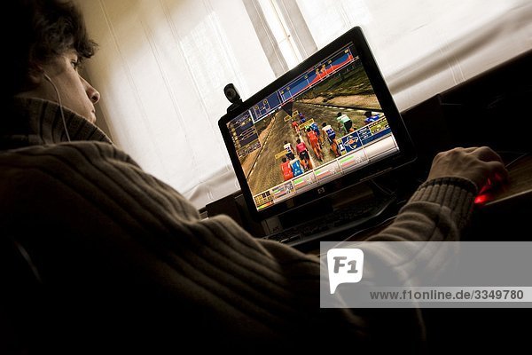 Man playing video game on computer home