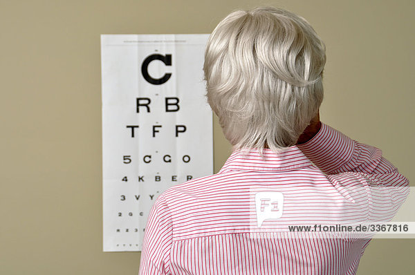 10864272  Visual Acuity  Eye  Test  Mature  Senior  Woman  Medicine  Old  Sick  Doctor  Chart  Eyes
