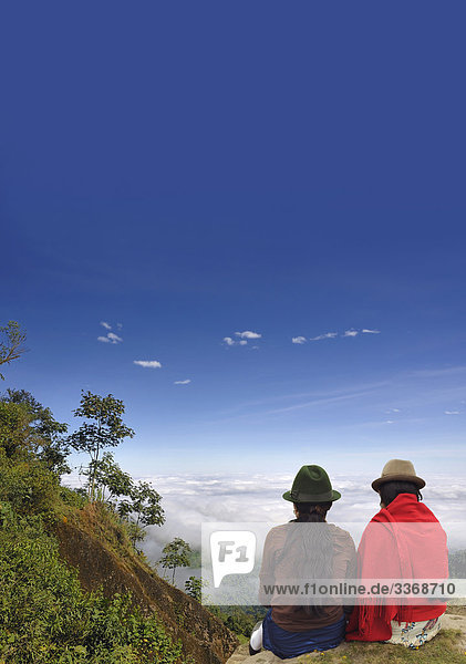 10867524  Clouds  Forest  Fog  near Puerto Inca  Ecuador  South America  people  2  indios  hats  travel