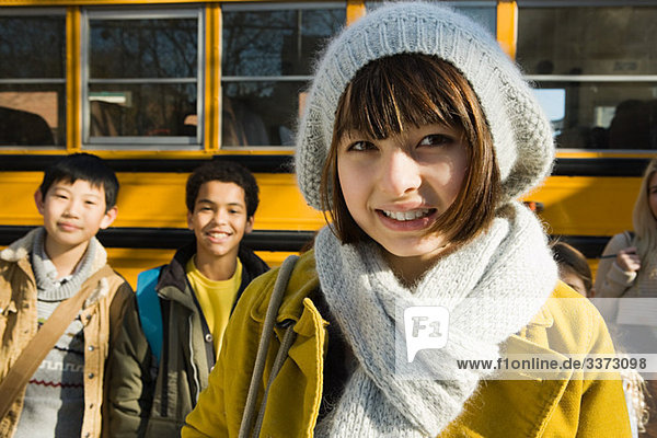 Children by school bus