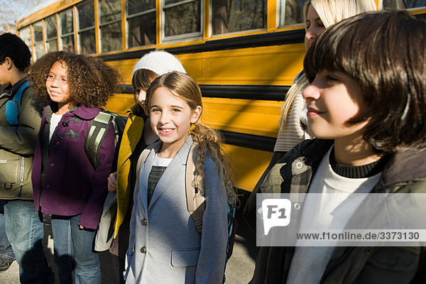 Children by school bus