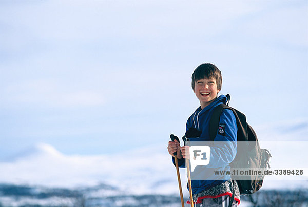 A boy skiing in the high mountains  Sweden.