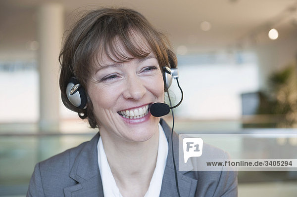 Laughing woman with headset