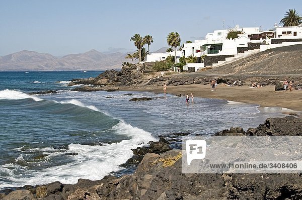 Tourists on the beach of Puerto del Carmen  Lanzarote  Spain  elevated view